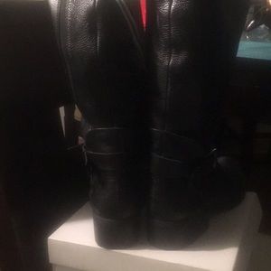 Tall black riding boots